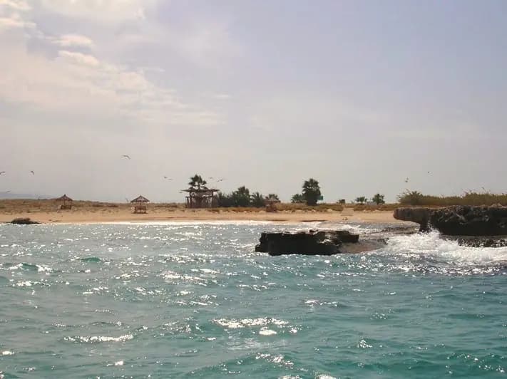 Beach and rocky shoreline on Rabbit Island off Tripoli